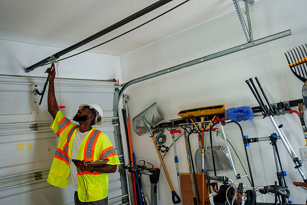 Professional Garage Door Panel Replacement technician working in Wellsville, MO